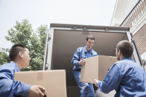 Packed office equipment ready for secure transport in a Highbury relocation