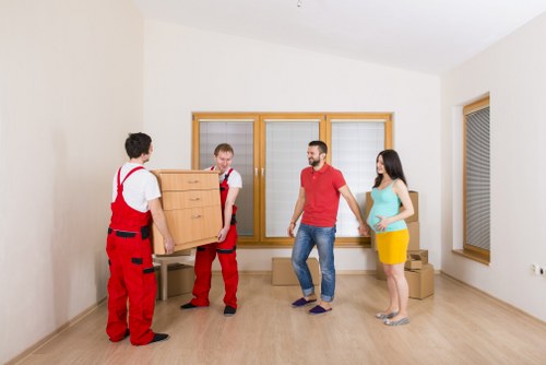 Careful handling of furniture during a flat move in Highbury