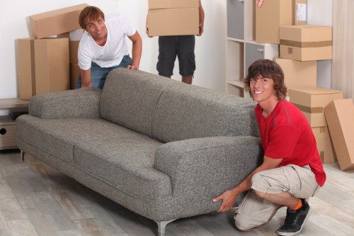 Careful wrapping of fragile household items during a Highbury move