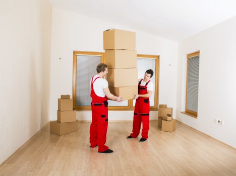 Boxes and small furniture prepared for a student move in Highbury